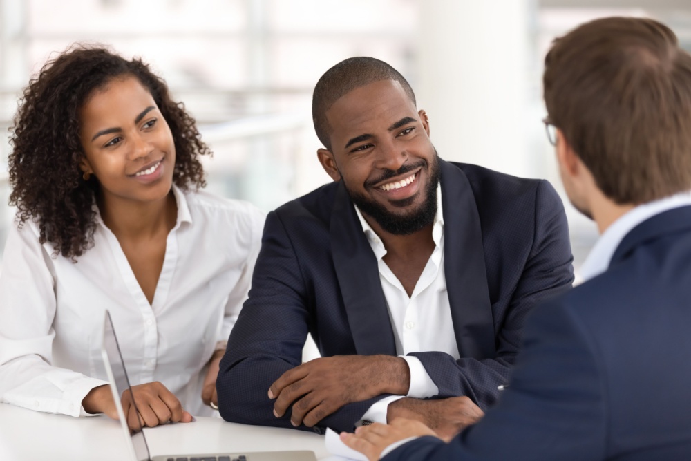 A couple taking to a financial planner.