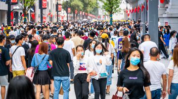 Crowd of Chinese people wearing surgical face mask