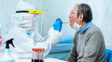 Coronavirus test - Medical worker taking a throat swab for coronavirus sample